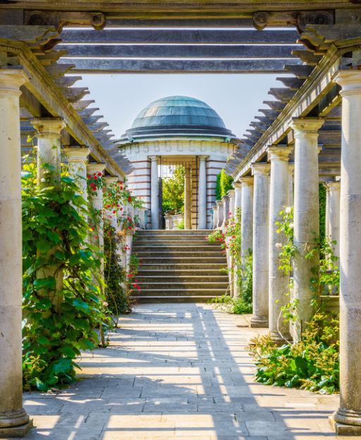 The Hill Garden and Pergola at Hampstead Heath, with stone columns and climbing roses lining the raised walkway