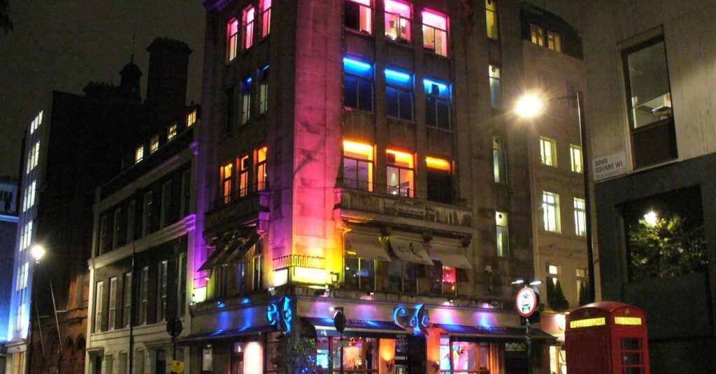 Vibrant street scene in one of London's best areas to stay, showing classic architecture and city life