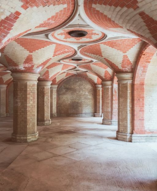 The ornate Victorian vaulted brick interior of Crystal Palace Subway, with geometric tilework in cream and terracotta
