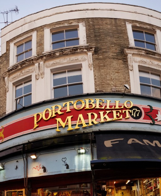Portobello Road Market sign on the iconic Notting Hill building