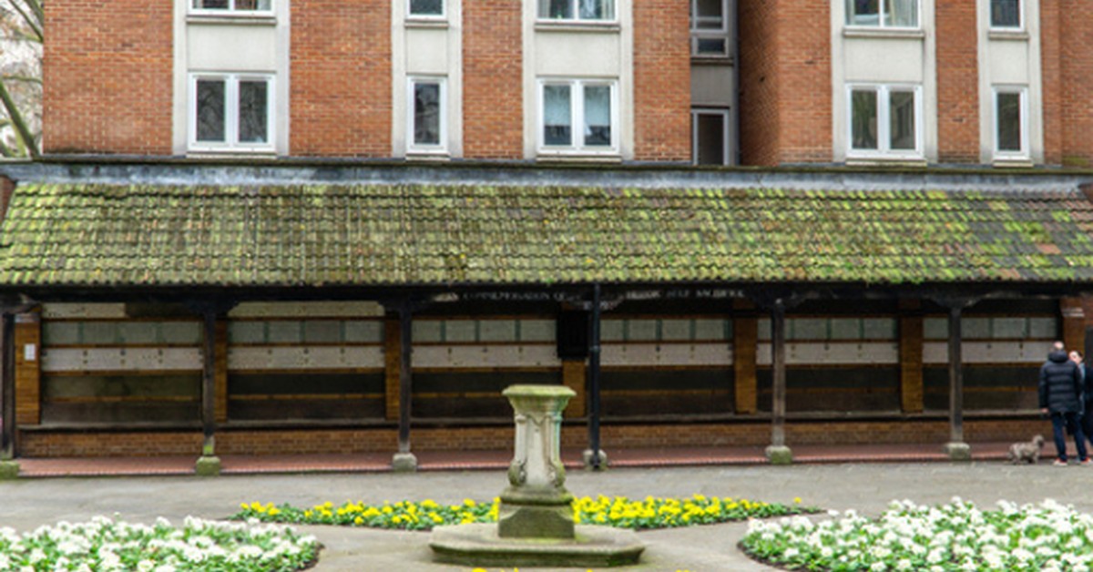 Postman's Park in the City of London, showing the garden and the covered cloister containing the Memorial to Heroic Self-Sacrifice