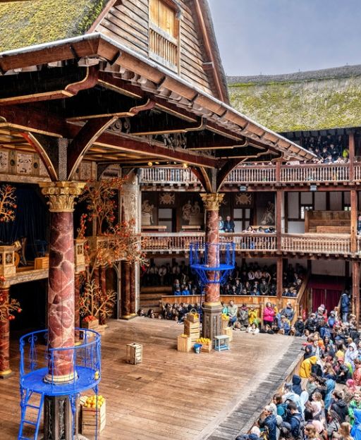 Inside Shakespeare’s Globe Theatre, London — audiences gathered on the open stage