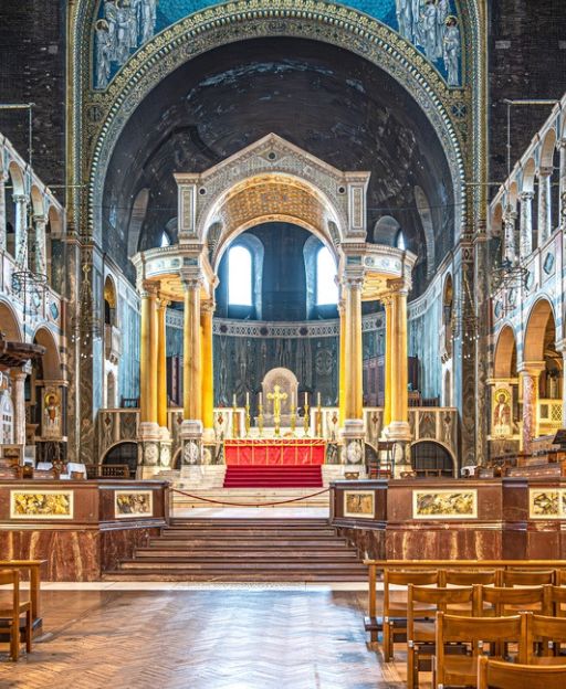 Westminster Cathedral interior showing Byzantine golden mosaics, marble columns and the ornate apse in London