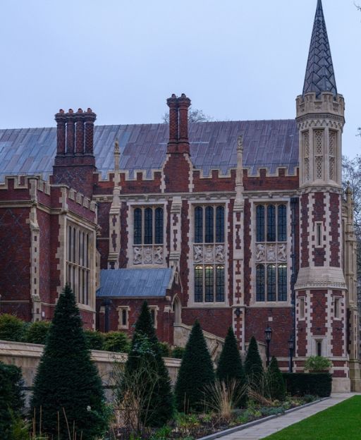 Lincoln's Inn, one of London's four Inns of Court — a Gothic-Victorian building with a soaring spire surrounded by green lawns