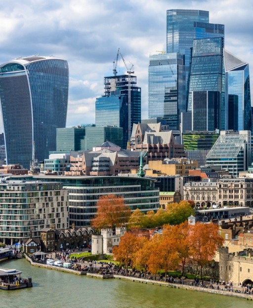 London skyline with the Tower of London and modern glass skyscrapers along the River Thames