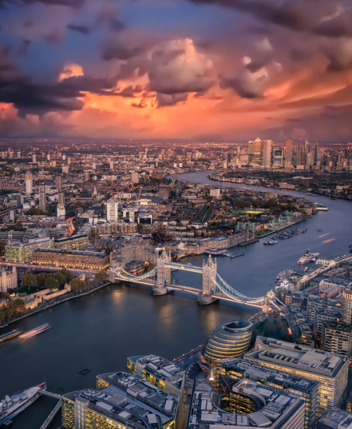 Aerial view of London skyline at sunset with Tower Bridge and the River Thames