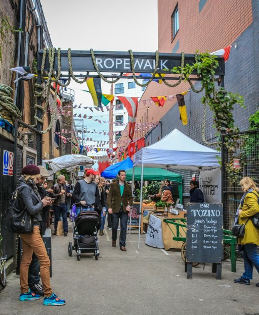 Rope Walk street market in SE1 London with artisan food stalls and shoppers