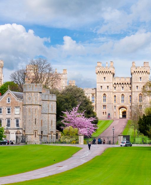 Windsor Castle and the Long Walk surrounded by spring cherry blossoms and green trees, London