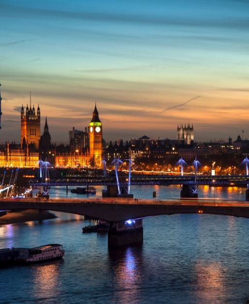 London skyline at dusk in winter, with Big Ben and the Thames lit up