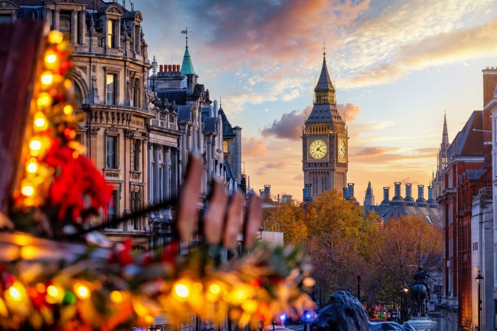 Big Ben clock tower at sunset seen from Trafalgar Square, London
