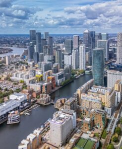 Aerial view of the Canary Wharf skyline and dock water on the Isle of Dogs, London