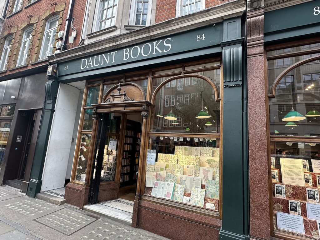 The green and wood shopfront of Daunt Books on Marylebone High Street.