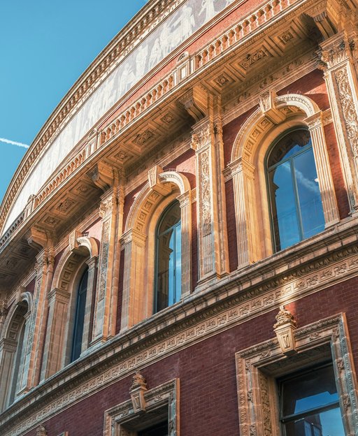 The red-brick and terracotta curve of the Royal Albert Hall in South Kensington