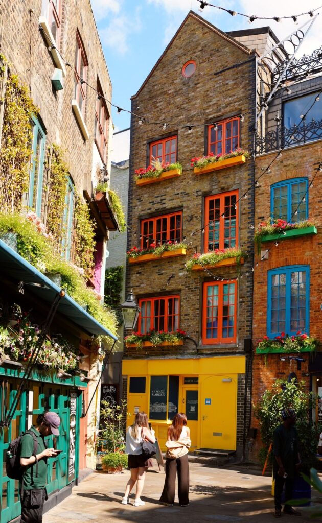 Colourful buildings with flower boxes in Neal's Yard, Covent Garden