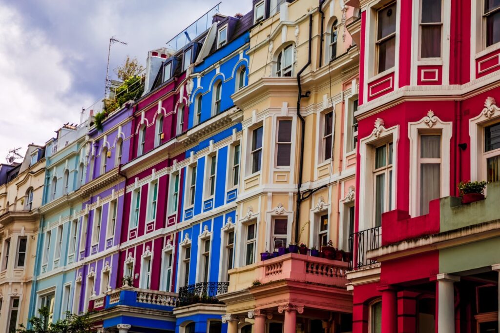 Row of colourful painted terraced houses in Notting Hill, London
