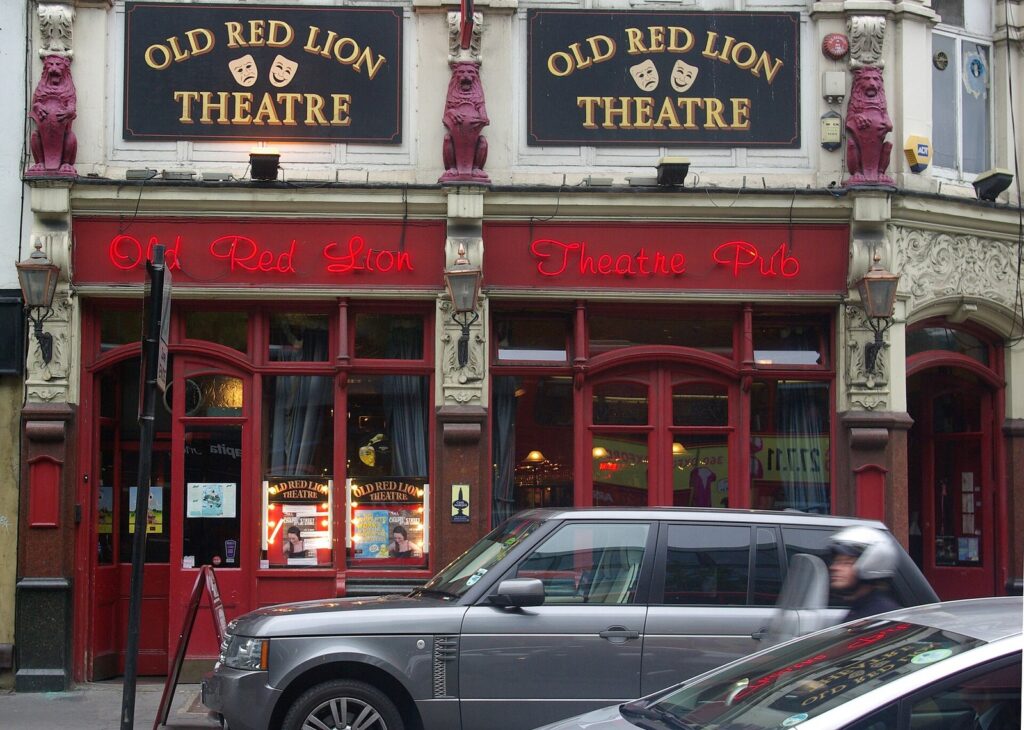 Red-painted front of the Old Red Lion Theatre Pub on St John Street, Islington, London