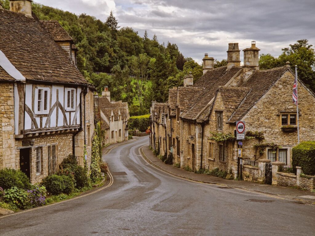 Stone cottages along the street in Castle Combe, in the Cotswolds