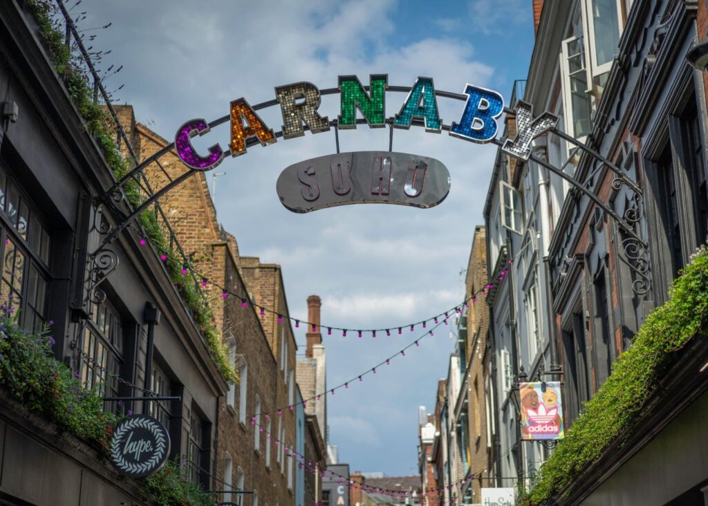 The Carnaby sign arching over Carnaby Street in Soho