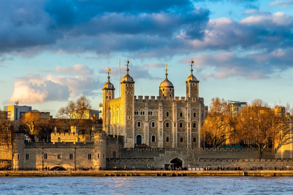 The White Tower and walls of the Tower of London seen across the Thames