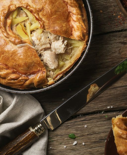 A traditional British savory pie with filling, the centrepiece of London's Victorian pie and mash tradition